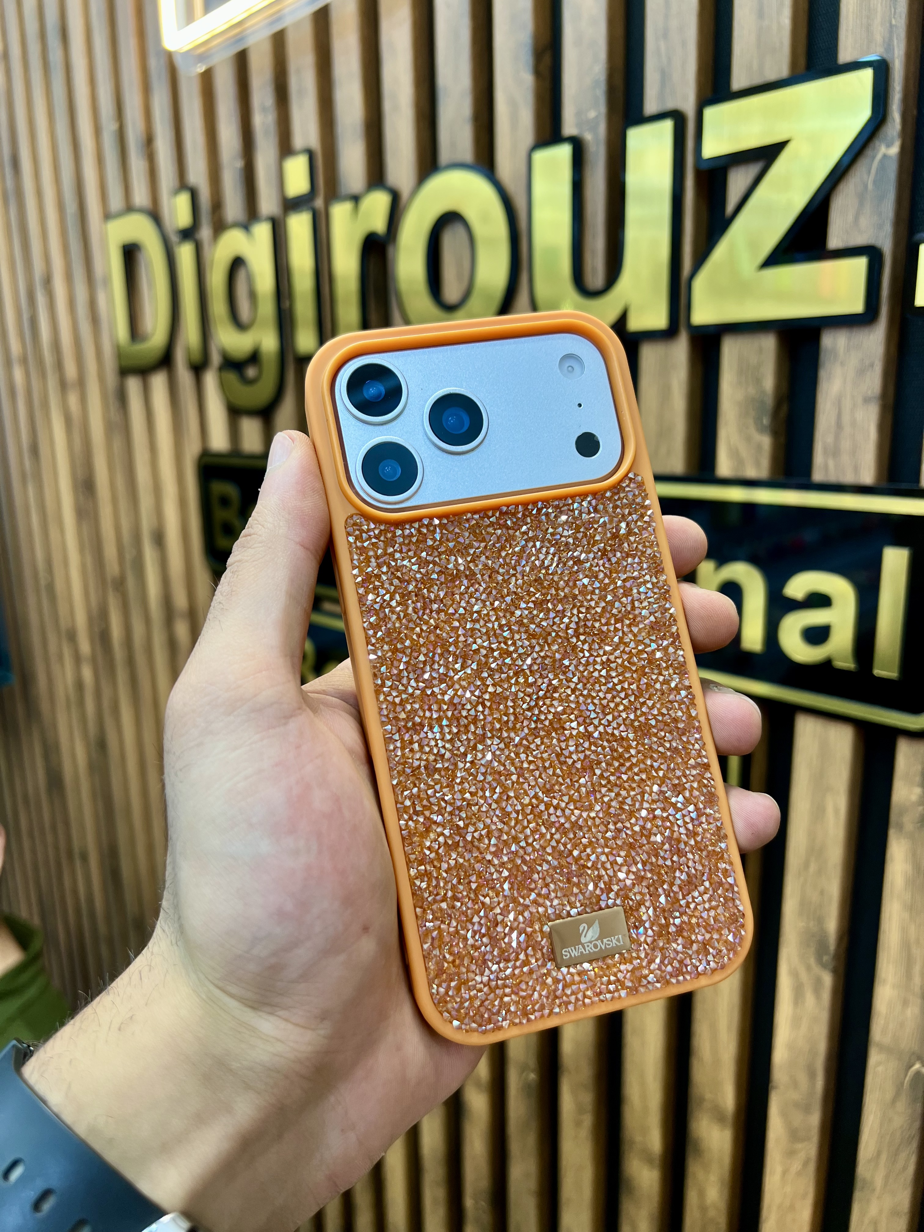 قاب فول نگین Swarovski Crystal Line آیفون 1۷ پرومکس رنگ Cosmic Orange